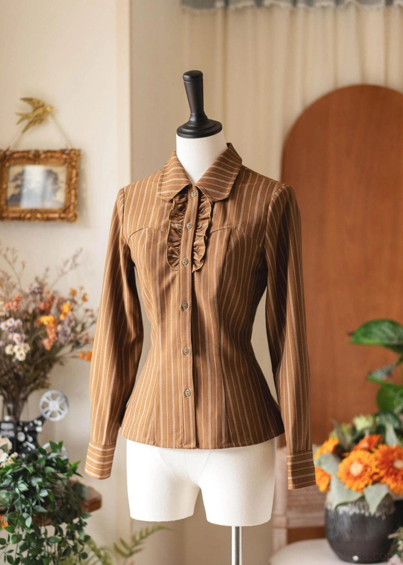 Brown vertical striped Lolita blouse with ruffled front detail, no bow tie, front full shot mannequin, pointed lapel button closure