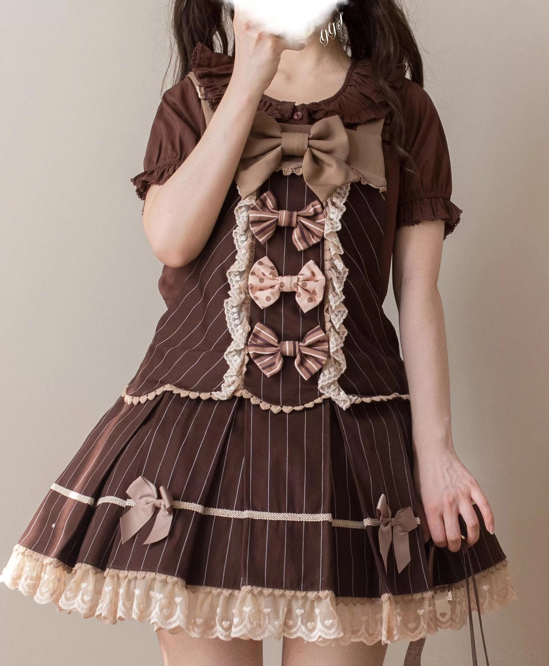 Brown striped sweet Lolita short-sleeve blouse front view showing striped fabric, multiple bowknot decorations on front placket, large bow neck accessory, and ruffled hem