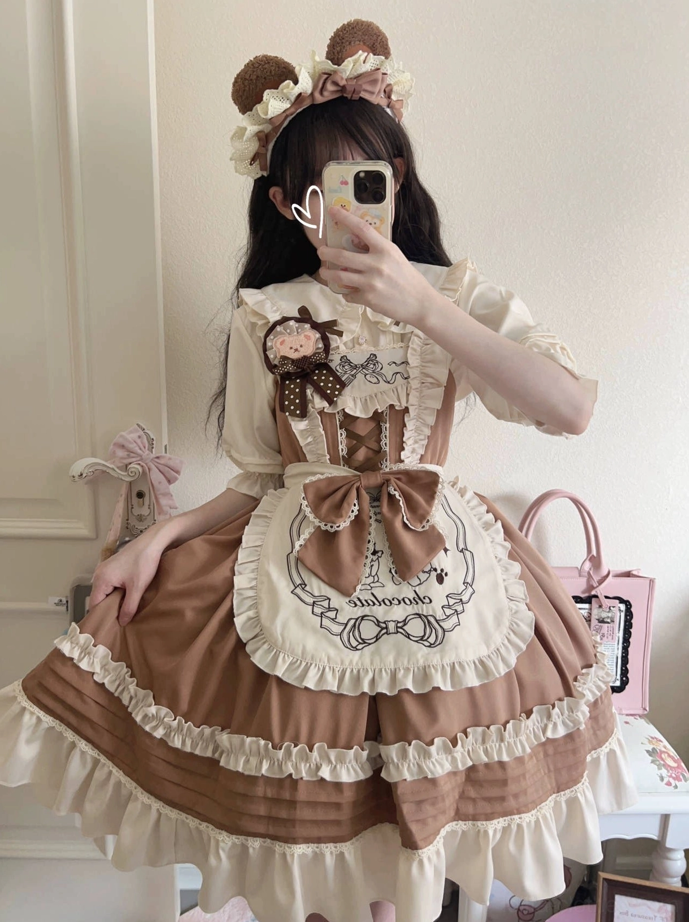 Brown tiered maid lolita jumper skirt with cream ruffled edges, embroidered front apron bow, paired with flower hair crown accessory