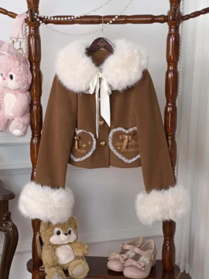 Brown fleece-lined sweet lolita coat with detachable faux fur collar and heart-shaped embroidered pockets, displayed on vintage wooden rack with lace trim and satin bow details