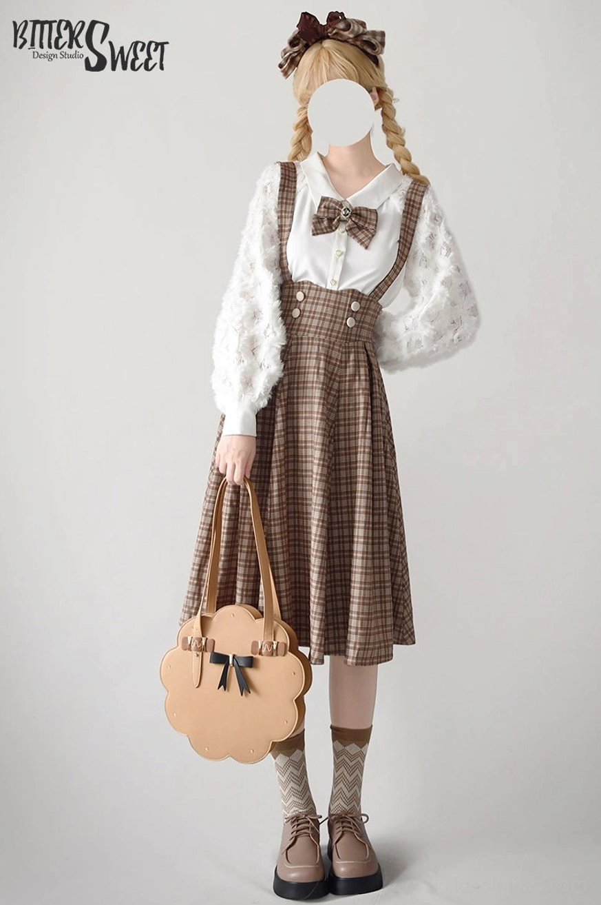 Brown tartan Lolita skirt front view with detachable suspenders, bow hair accessory and flower-shaped leather handbag, displaying the complete suspender system and plaid pattern details