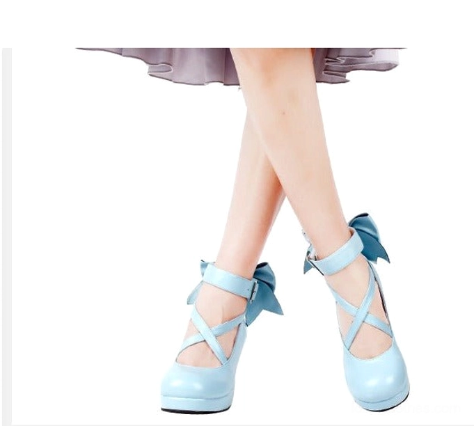 Brown vintage-inspired Lolita platform high heel shoes with matte finish, crossover ankle buckle straps, small decorative back bow, round toe, and block heel - classic coordinate option