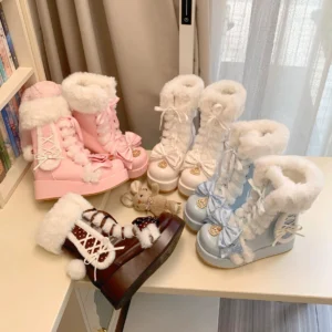 Overhead flat lay view of multi-color sweet lolita winter platform boots with fluffy bunny ears, showing all three color variants arranged with decorative plush toys and accessories