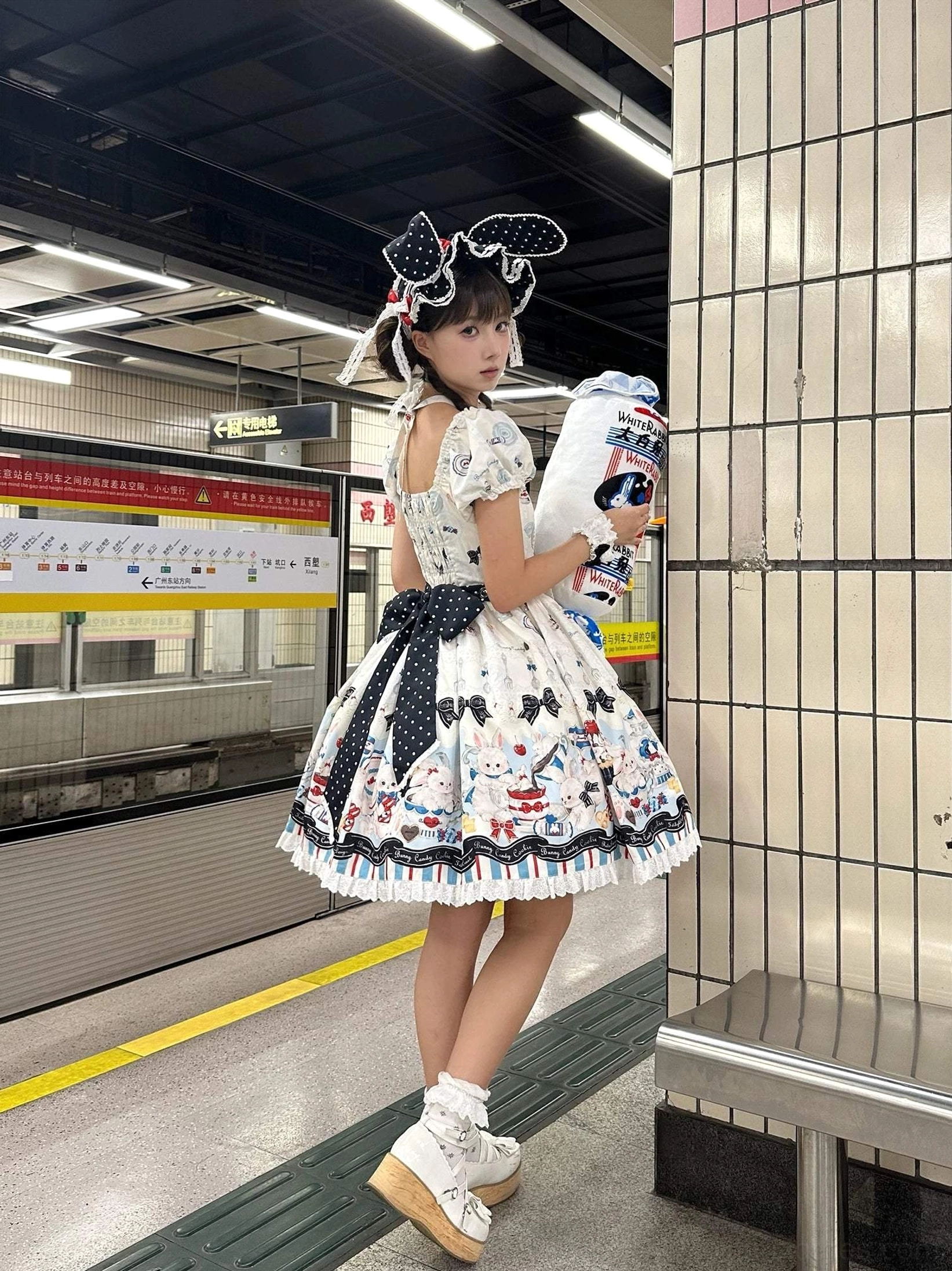 Myth Rabbit Tea Party Sweet Lolita JSK dress side full-body shot cat ear headbow subway station blue striped waist bow