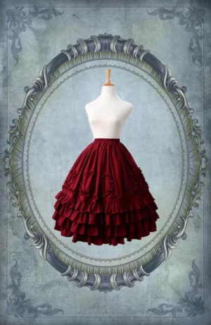 Burgundy wine red court style Lolita underskirt with multi-tiered ruffled hem and embroidered decorative patterns displayed in vintage decorative frame showing full skirt silhouette