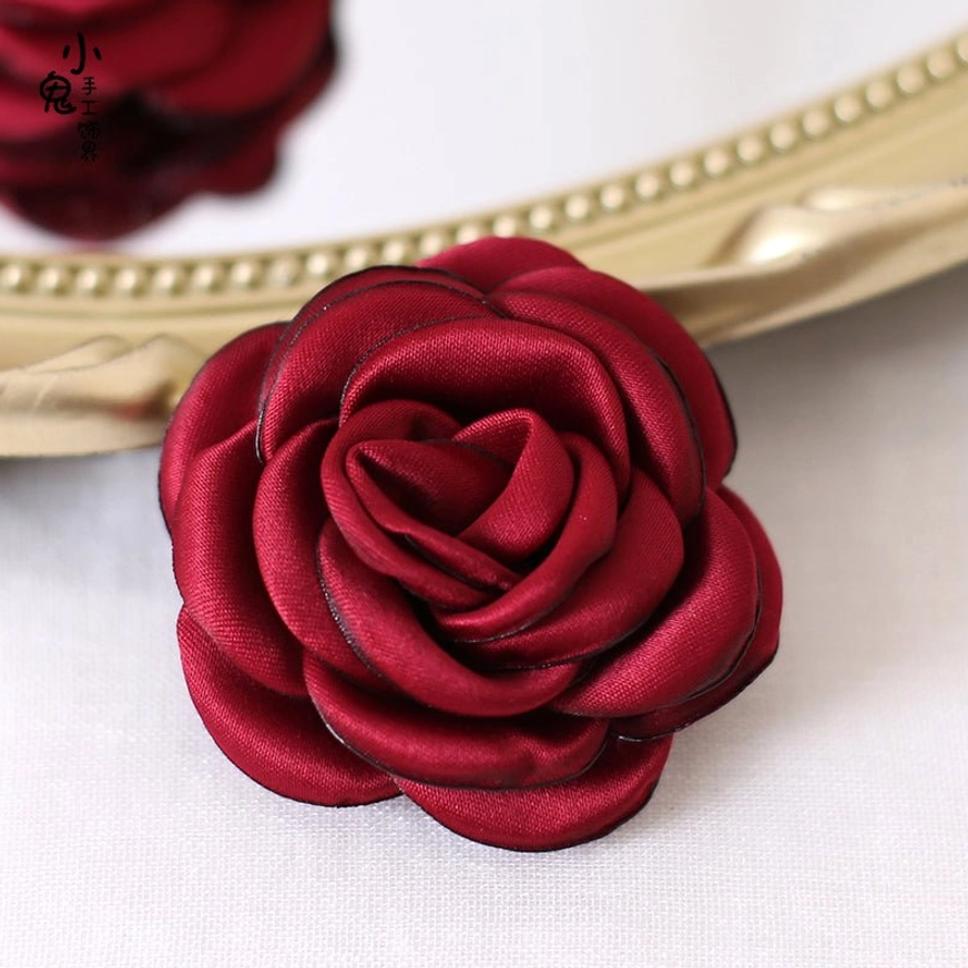 Burgundy colored fabric rose brooch and hair clip showing sophisticated depth and vintage burnt-edge technique for Lolita fashion