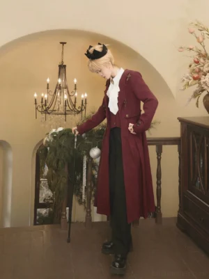 Dracula-inspired gothic ouji lolita ensemble side back standing view showing structured coat waist design formal black serge pants and wooden walking cane accessory vintage interior