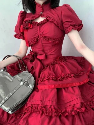 Burgundy gothic lolita JSK with short sleeve puffed bolero close-up upper-body view showing hollow chest cutout and rose bow trims
