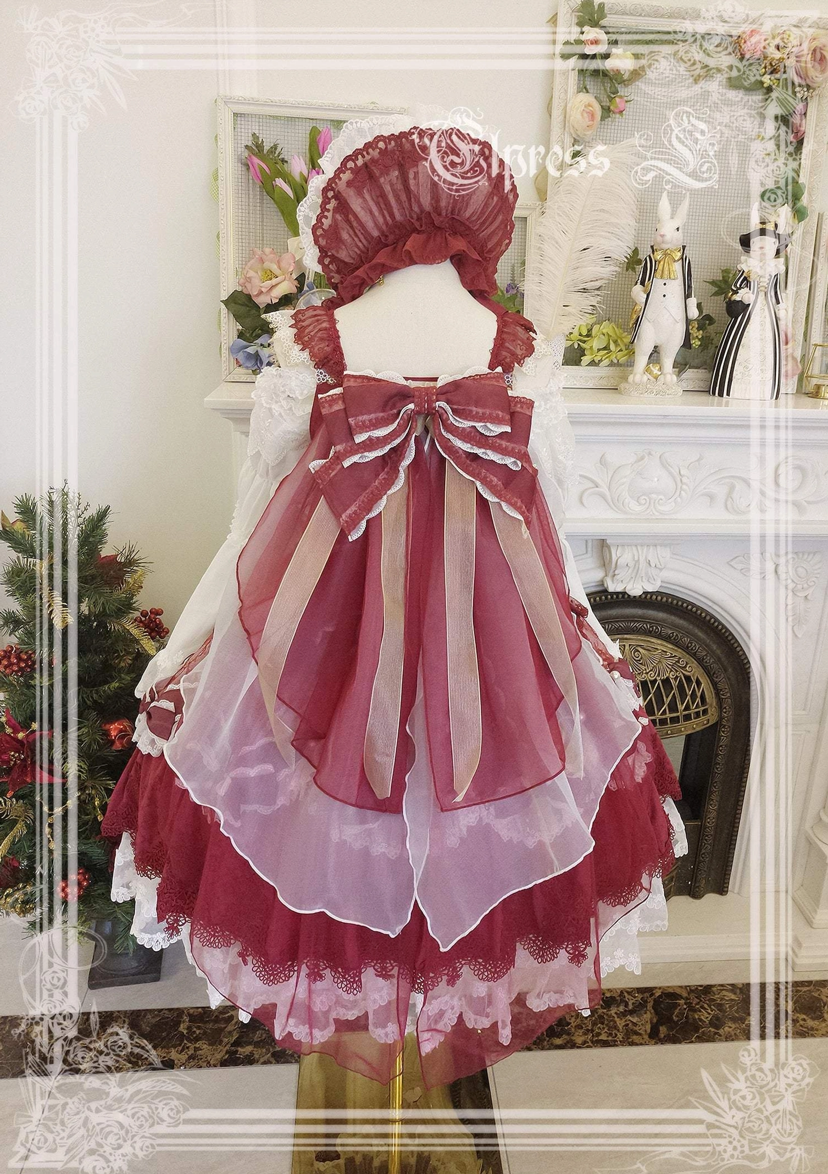 Burgundy wine red lolita JSK jumper skirt dress back view with oversized satin butterfly bow and gradient organza layers festive Christmas aesthetic