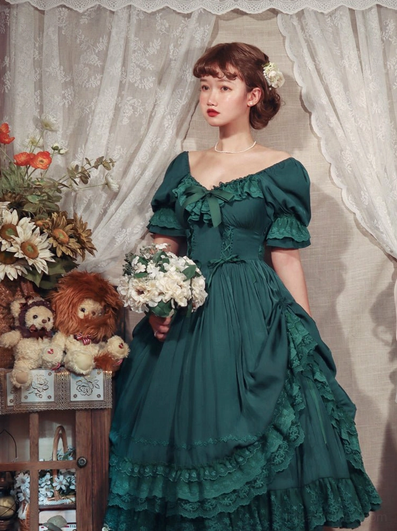 Burgundy French Lolita one-piece dress showing signature puff sleeves and romantic silhouette in styled setting