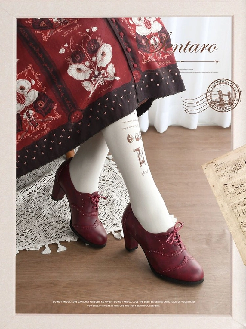 Burgundy wine-colored lolita perforated leather heel shoes with smooth leather construction and rounded toe, side profile view showing low block heel and lace-up detail