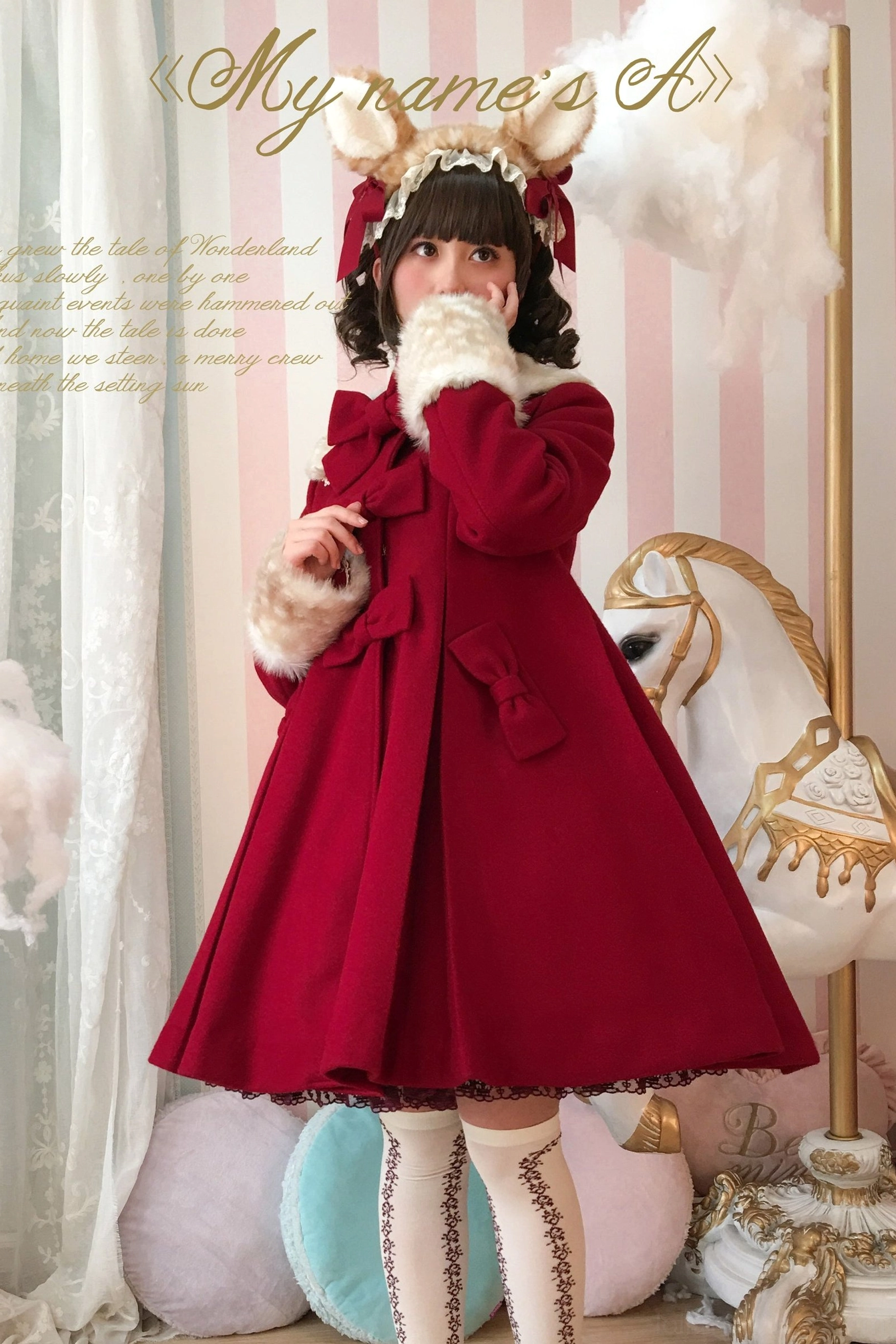 Wine red burgundy lolita overcoat half-body front view with animal ear hair accessory indoor carousel studio setting
