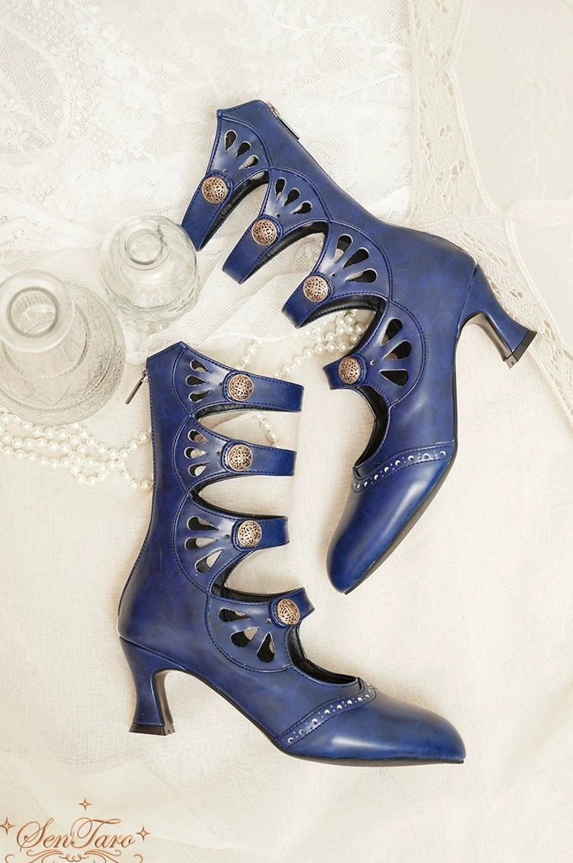 Burgundy Mary Jane Lolita boots showing wine glass heel architecture and four-strap multi-buckle system detail
