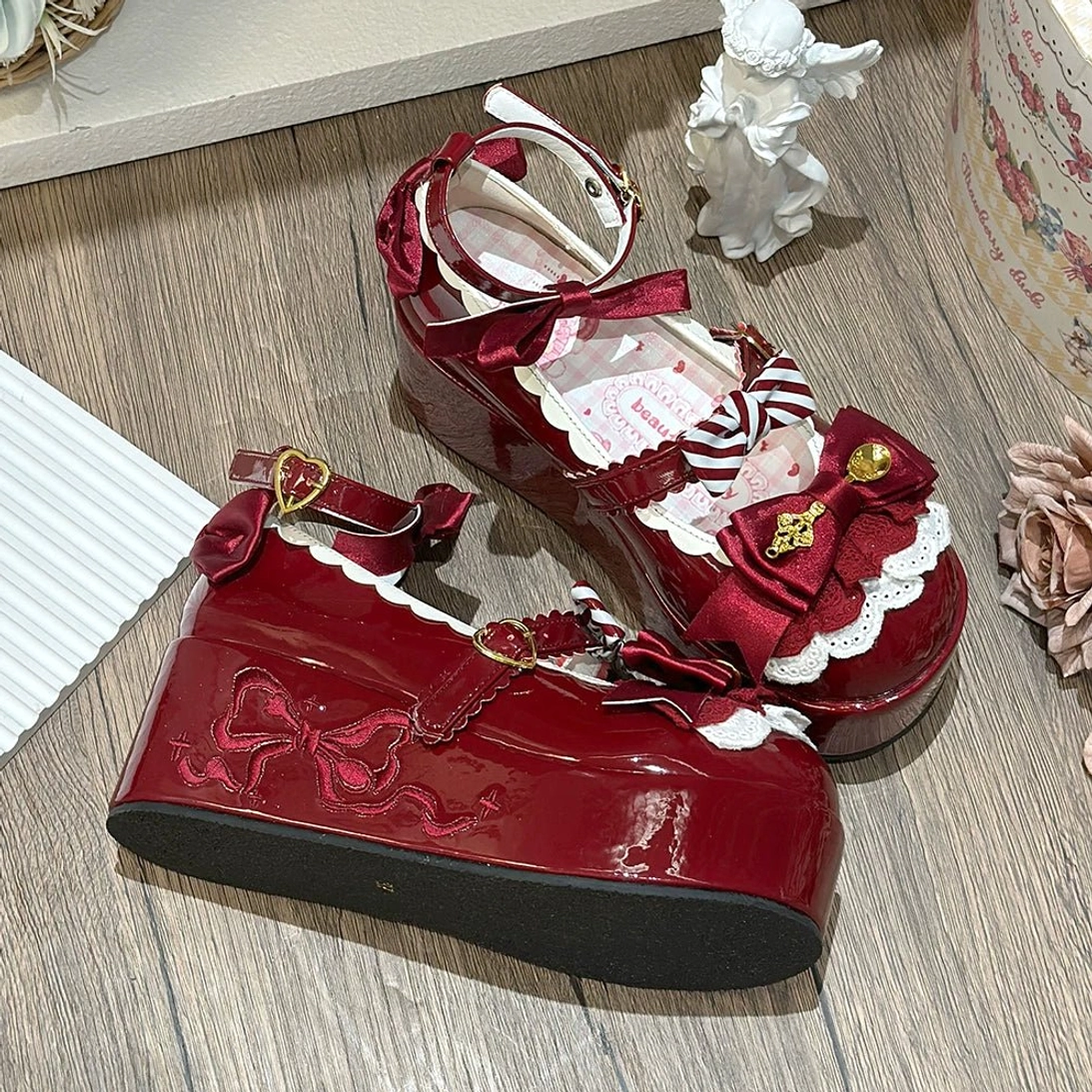 Burgundy mousse roll platform sweet lolita shoes full product shot displaying wine red patent leather ankle strap and embroidered bow pattern