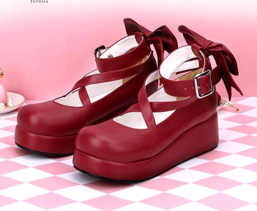 Burgundy wine red platform Lolita leather shoes three-quarter front view crisscross ankle straps large back bow thick platform sole