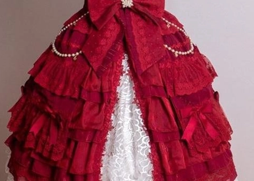 Burgundy waltz lolita trailing with rich color, asymmetrical mesh construction, dimensional floral appliqués, and ornate pearl chain embellishment detail