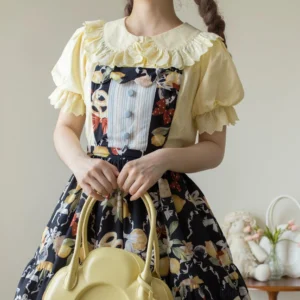 Butter yellow ruffled lolita cotton blouse with Peter Pan collar and lace trim front medium close-up with floral JSK dress and yellow heart handbag
