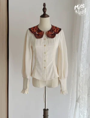 Classic butterfly collar lolita blouse front view cream off-white fabric leopard print butterfly-shaped collar ruffled long cuffs displayed on dress form