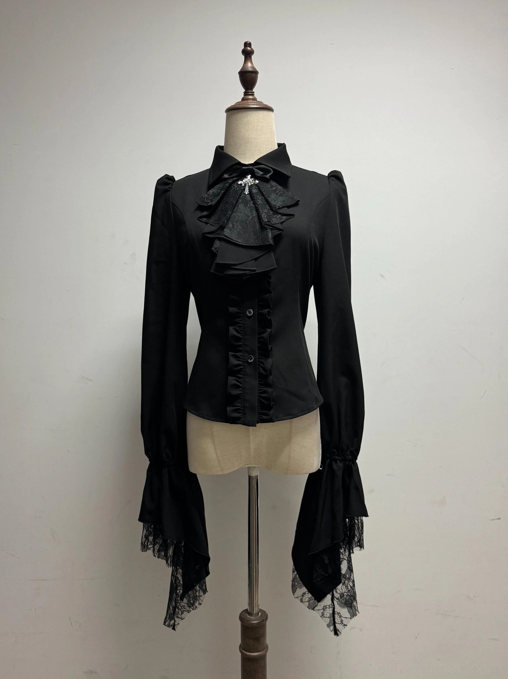 Black long sleeve butterfly shadow gothic lolita blouse flared sleeves lace trim detachable cross brooch jabot fitted waist studio view