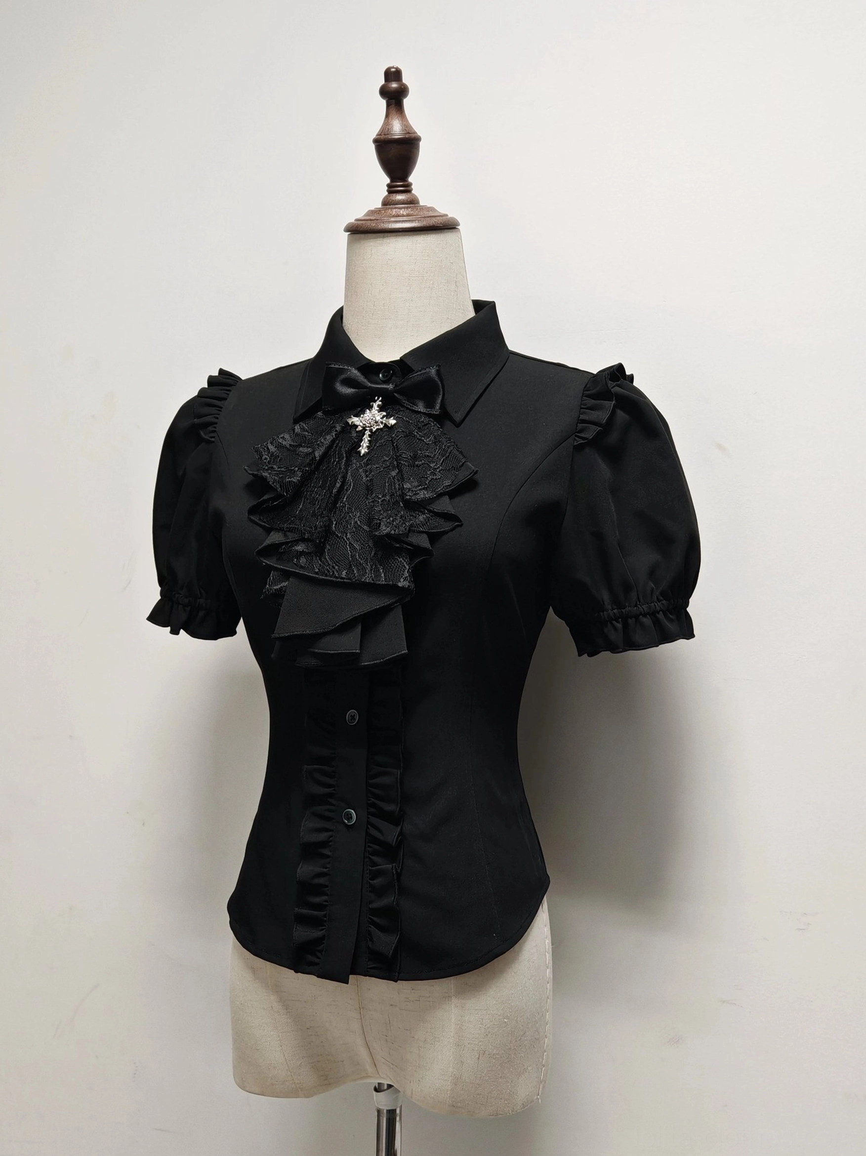Black short sleeve butterfly shadow gothic lolita blouse with puff sleeves ruffled bow cravat cross ornament fitted silhouette dress form display