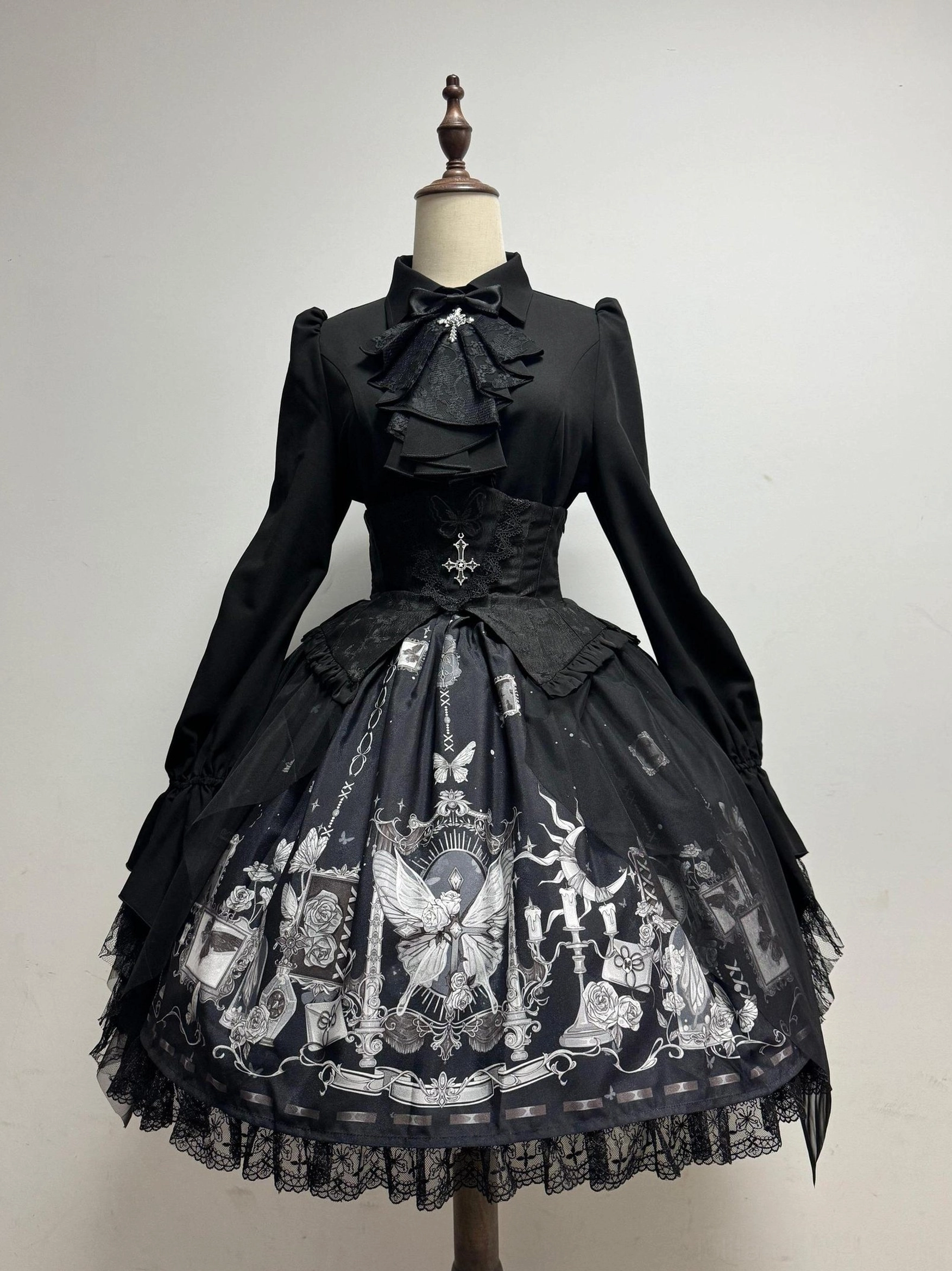 Gothic Lolita butterfly shadow corset skirt and detachable jabot blouse full set displayed on dress form front view with butterfly clock print