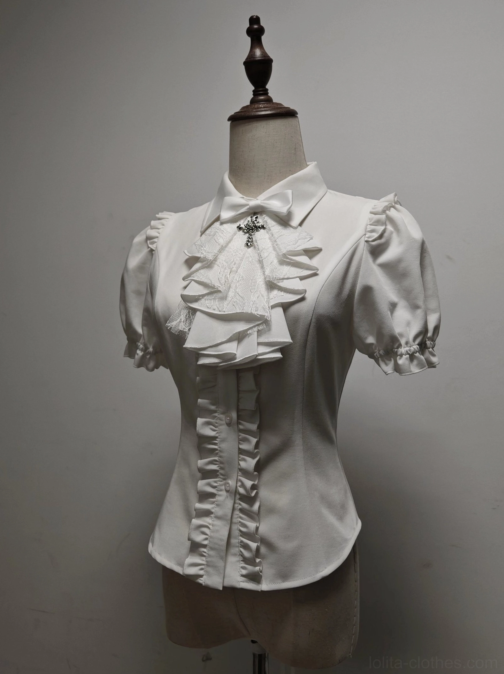 White long sleeve butterfly shadow gothic lolita blouse with detachable jabot cross brooch ruffled front placket fitted waist on dress form