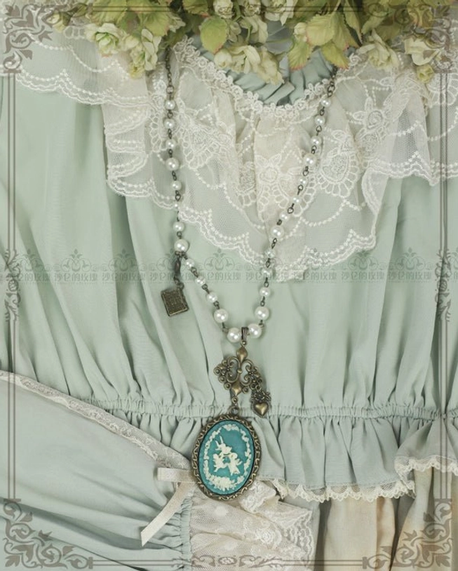 Cameo lolita necklace worn on chest close-up display mint green lolita dress white lace ruffled collar