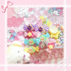 Multiple pastel candy hair clips and rings in pink purple yellow mint colors with bow star decorations on checkered background kawaii decor