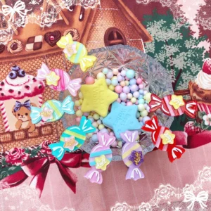 Pastel rainbow candy-shaped lolita hair accessories flat lay with gingerbread fairy tale dessert table theme sparkly glitter finish