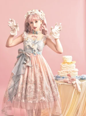 Sweet lolita carousel JSK dress front three-quarter view on model with pink studio backdrop, bicolor blue-pink bodice, large satin waist bow, and tulle ruffled skirt hem
