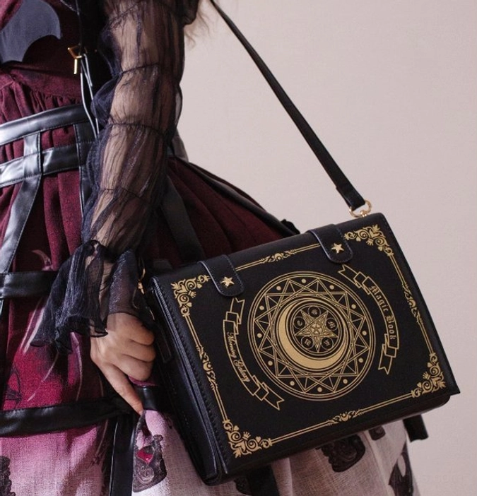 Celestial-inspired grimoire lolita crossbody clamshell bag with premium materials and intricate embellishment craftsmanship