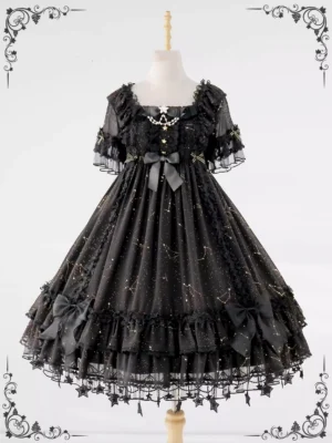 Black constellation lolita one-piece dress displayed on dress mannequin showing short ruffled sleeves, square neckline with gem brooch, and layered ruffled skirt with star hem trims