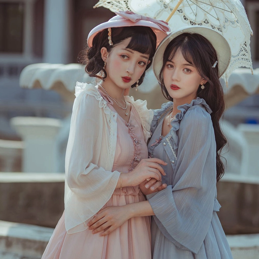 Champagne lolita cardigan ethereal styling displayed on mannequin showing delicate dimensional ruffles, sheer chiffon elegance, and romantic lolita fashion aesthetic