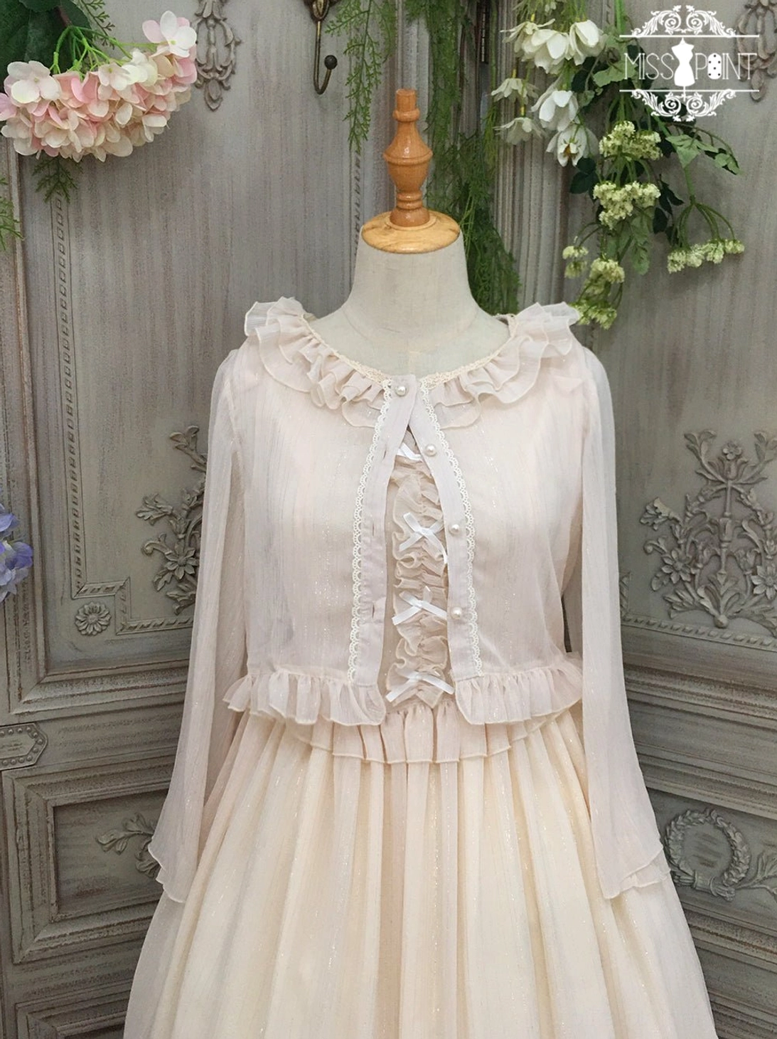 Champagne lolita cardigan with ruffled neckline and shoulders, delicate lace-up front detail, ruffled waist trim, ethereal sheer chiffon overlay perfect for elegant lolita coordinates