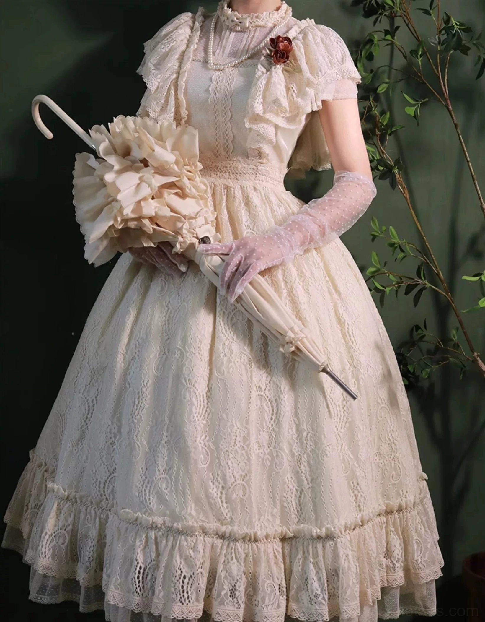 Champagne Lolita OP dress modeled with coordinate accessories including pearl necklaces, floral headpiece, veil, and Mary Jane shoes for complete authentic Lolita ensemble