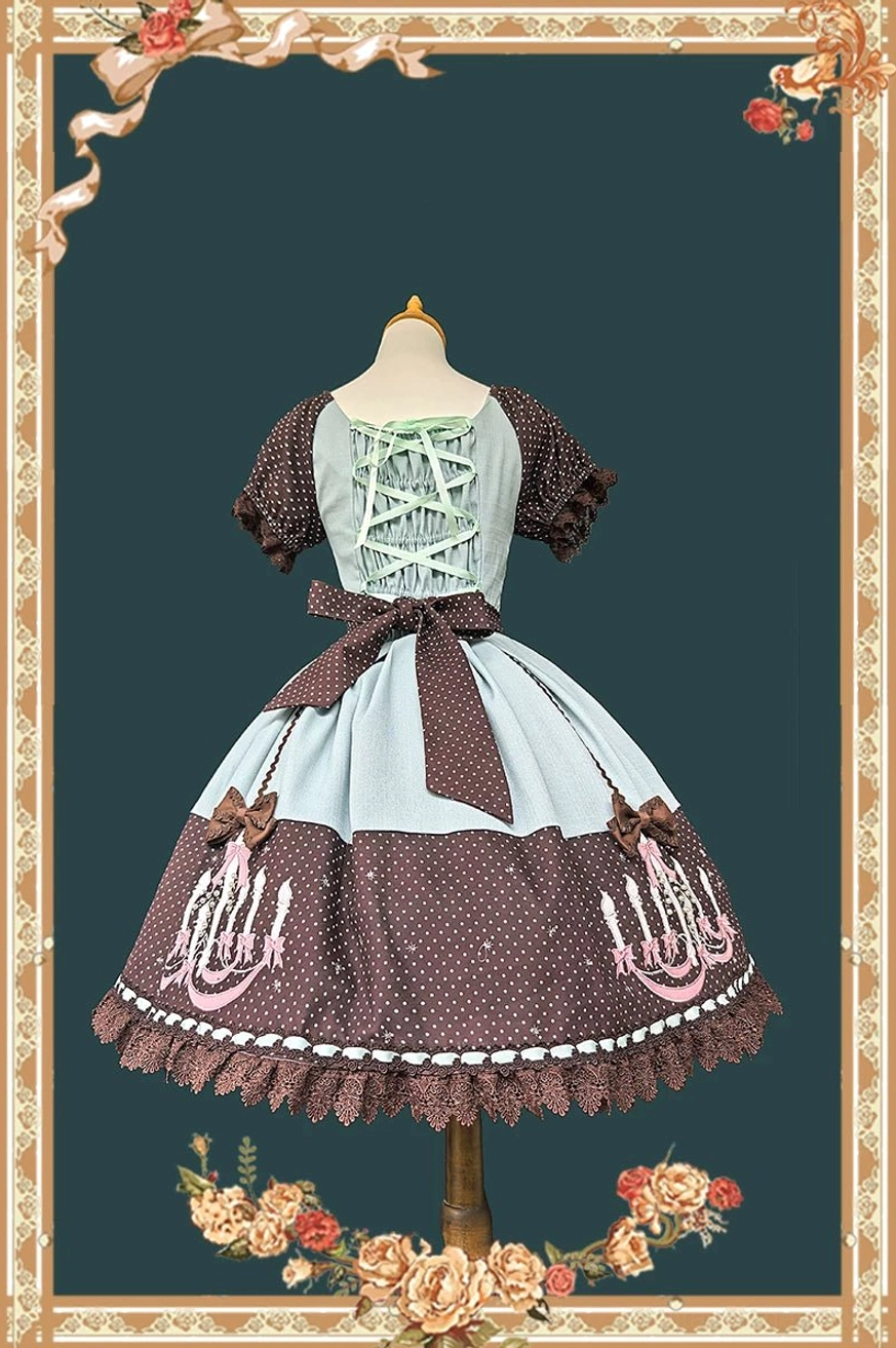 Detailed close-up of chandelier polka dot lolita OP dress print showing intricate chandelier motif woven throughout polka dot fabric pattern and construction quality