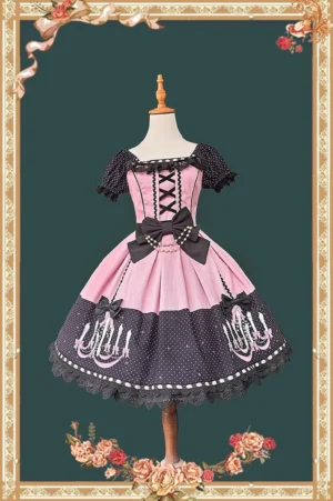 Front view of pink and black vintage chandelier polka dot old school lolita OP dress with off-the-shoulder ruffled sleeves, lace-up corset, and scalloped skirt trim on wooden dress mannequin