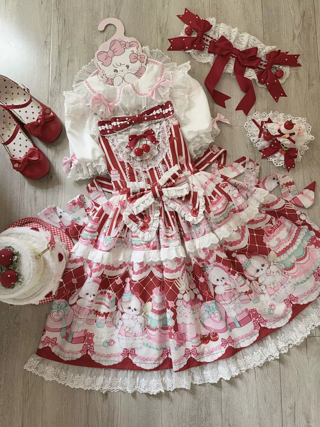 Cherry Bake Song Kawaii Lolita Jumper Skirt in blue colorway, full garment display showing dessert print composition across entire skirt surface and lace embellishment