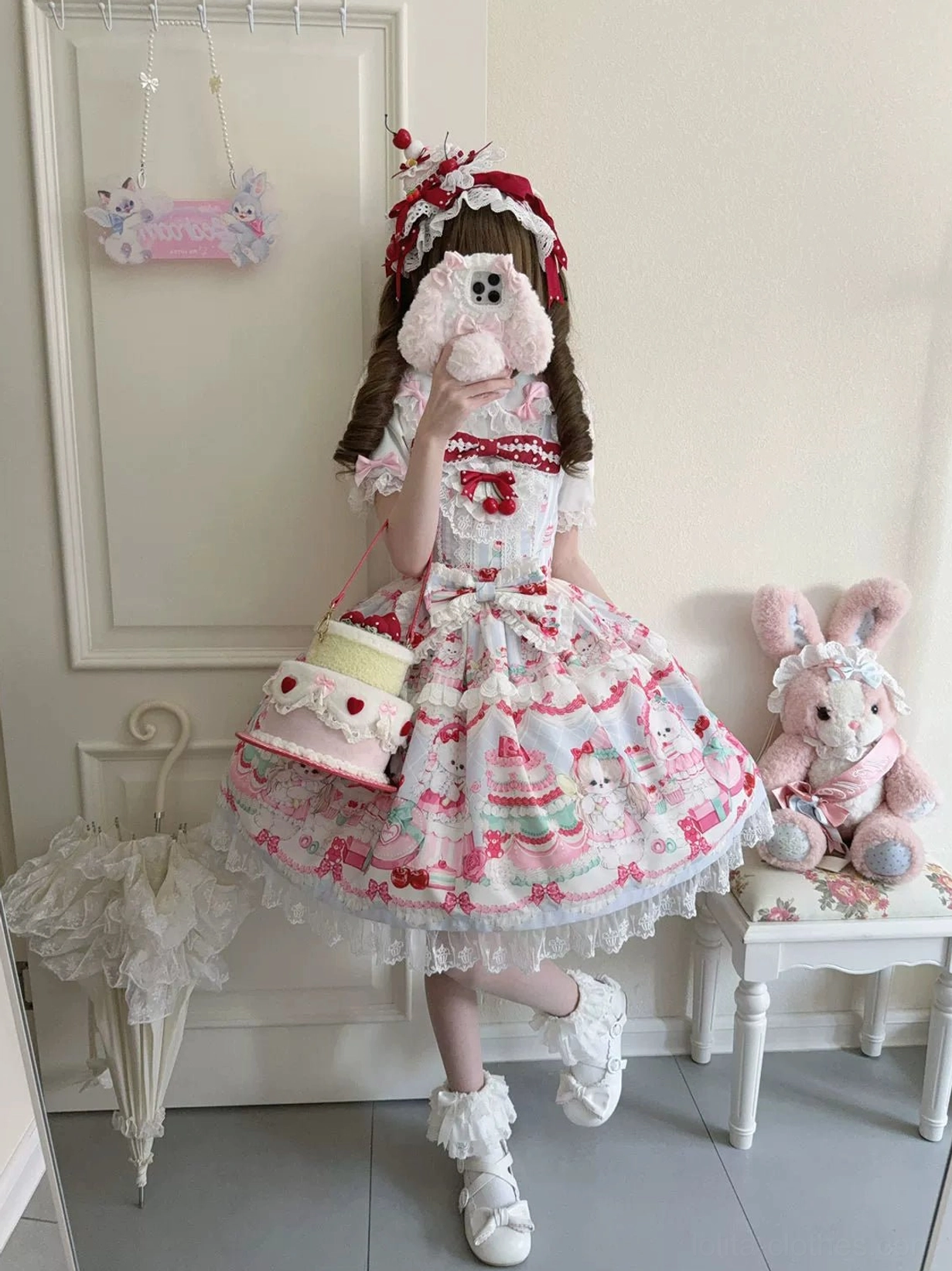 Cherry Bake Song Lolita JSK front bodice and waist detail showing bow placement, lace panel construction, and shoulder strap adjustment mechanism
