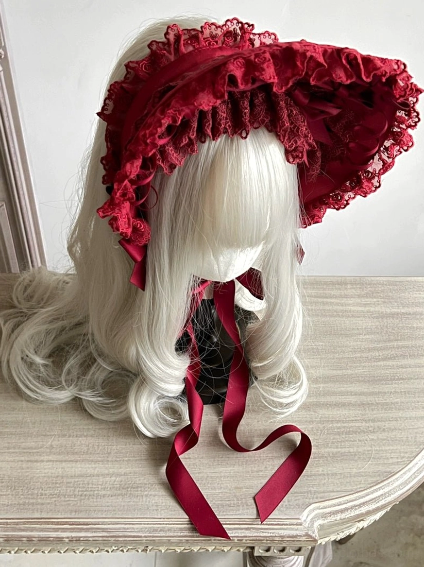 Cherry pink gothic lolita lace bonnet with wide ruffled brim, decorative bows, adjustable chin tie, sweet lolita color variation
