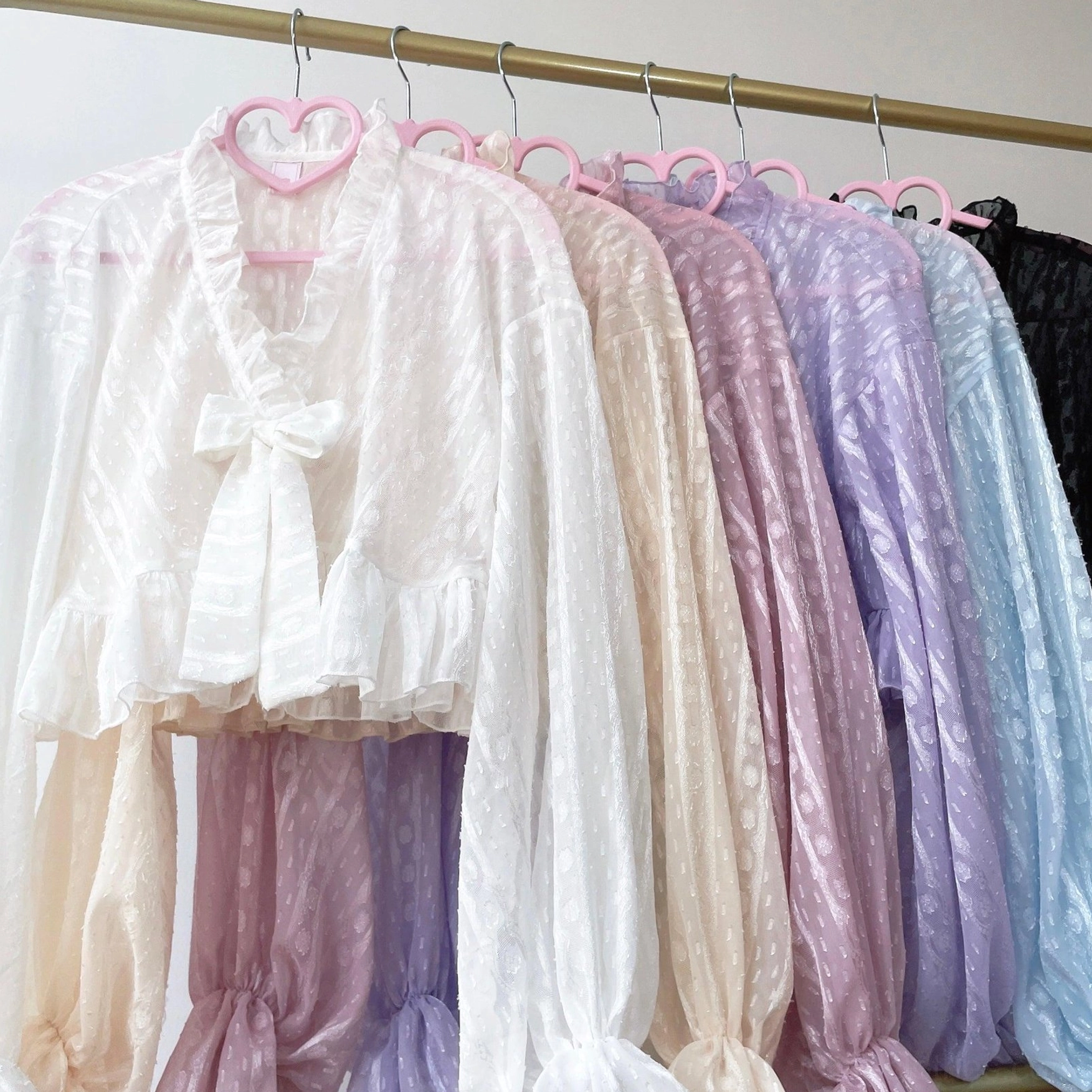 Multi-color option display of dotted chiffon puff sleeve Lolita cardigans showing ivory sky blue violet black white colorways
