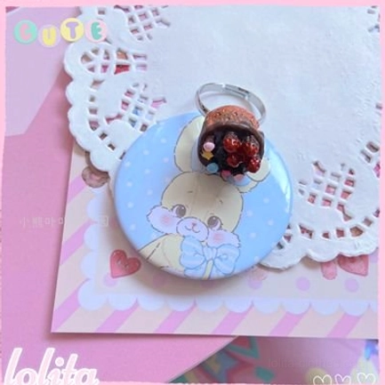 Chocolate cake lolita ring variant showing rich brown tones and miniature cupcake styling with bead toppings