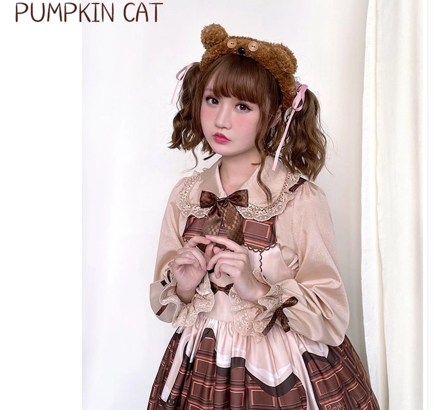 Chocolate Heart Lolita long-sleeve blouse detail view of puffed lantern sleeves with ribbon tie fastenings and ruffled cuffs