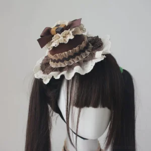 Chocolate themed lolita cake mini top hat with layered ruffled lace trim and satin bow worn on mannequin side view