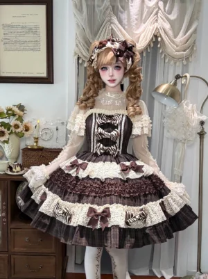Front full-body view of chocolate plaid lolita JSK dress with layered cream lace ruffles and zebra-patterned bows on vintage dollhouse background