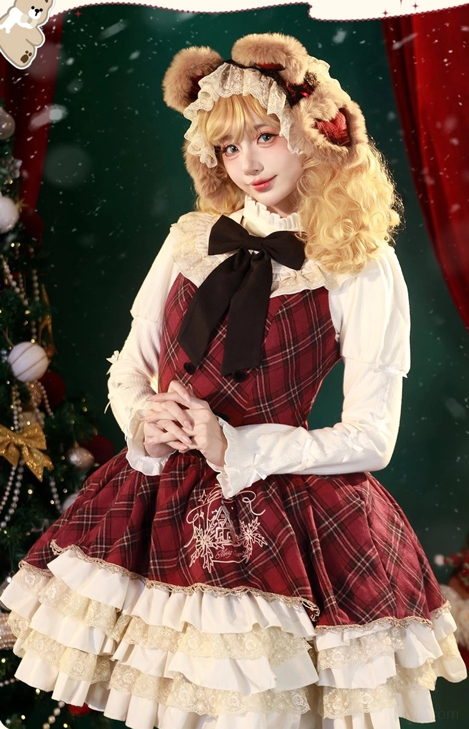 Full front view of Christmas plaid lolita JSK with white inner shirt, oversized black bow necktie, multi-layered ruffled skirt hem, and embroidered bodice