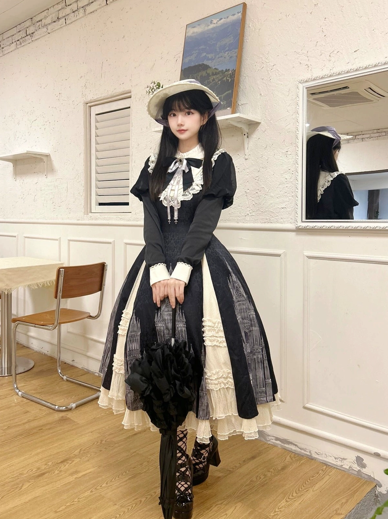 Church Bell gothic lolita OP dress waist and skirt panel detail displaying fitted waist shaping, black bow embellishments, and ivory contrast panel construction