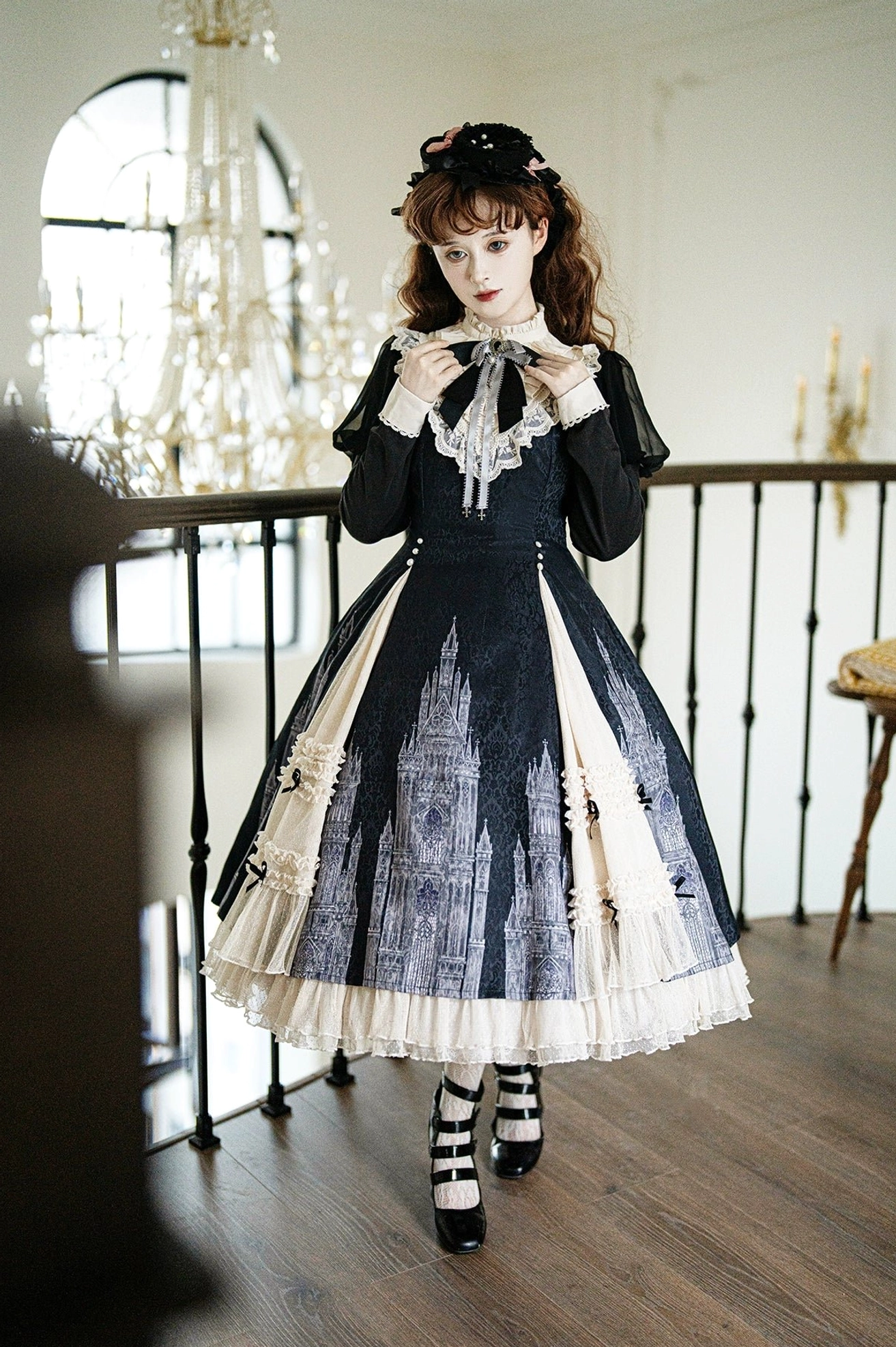 Church Bell gothic lolita OP dress front three-quarter view with matching hair bow headwear, striped stockings, Mary Jane shoes, and side black bow details on skirt