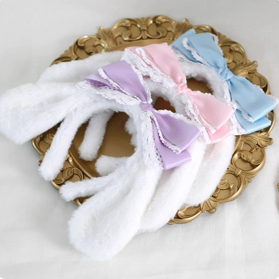 Three color Cinnamoroll plush ear lolita headbands collection blue pink purple satin bows on vintage gold decorative plate flat lay