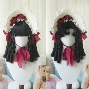 Pure black lolita short roman curl wig with blunt bangs and twin curly pigtails on display mannequin with straw bonnet wine red ribbon bows classic gothic lolita coordinate styling teddy bear backdrop